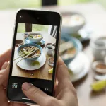 female-hands-taking-photo-two-bowls-ramen